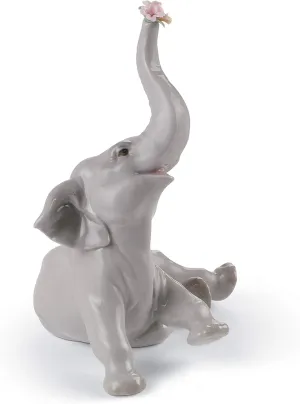 LLADRÓ Glossy Porcelain Figure of Baby Elephant with Pink Flower. Decorative Porcelain Animal Figurine.